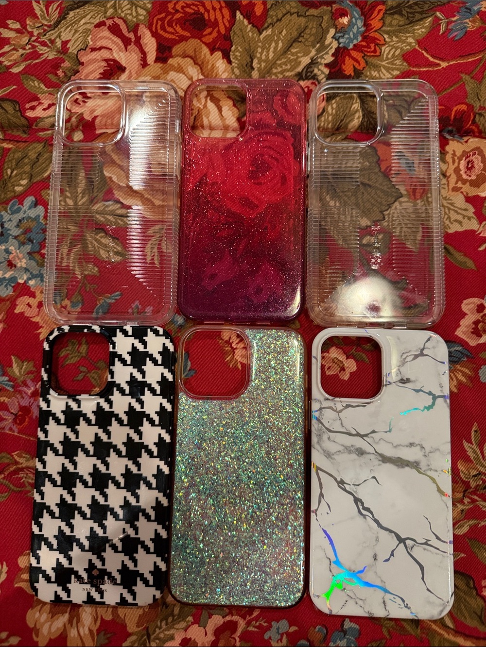 6 iPhone 15 covers. 1 Kate Spade, 2 Specks and 3 unknown